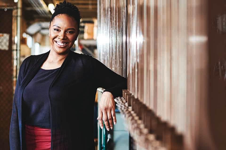 African American woman smiles at the camera